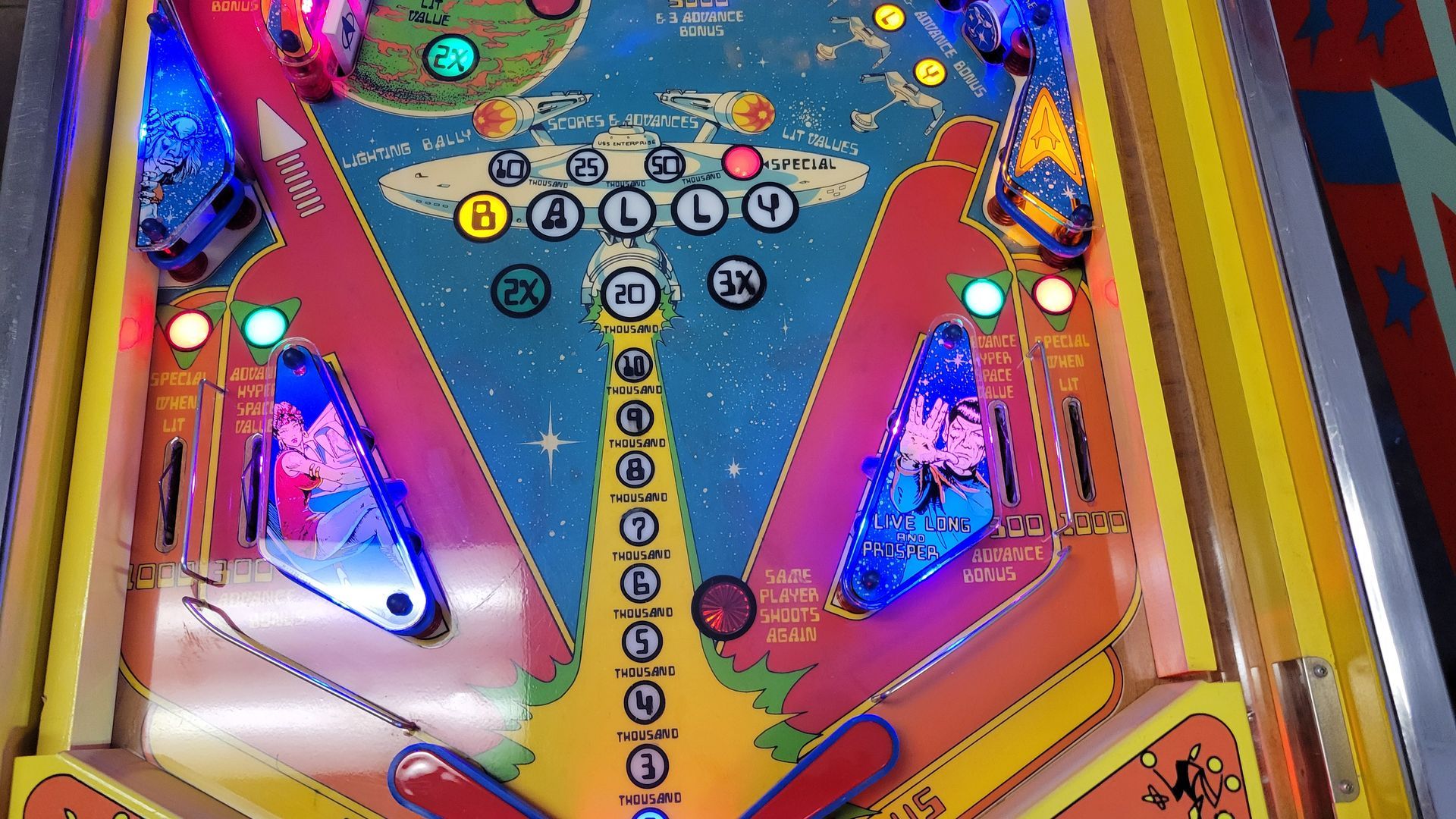 A pinball machine with a lot of lights on it