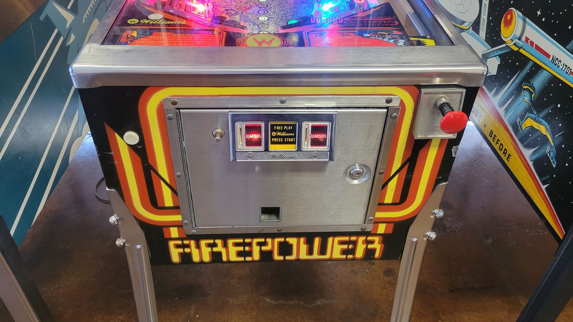A pinball machine that says firepower on it
