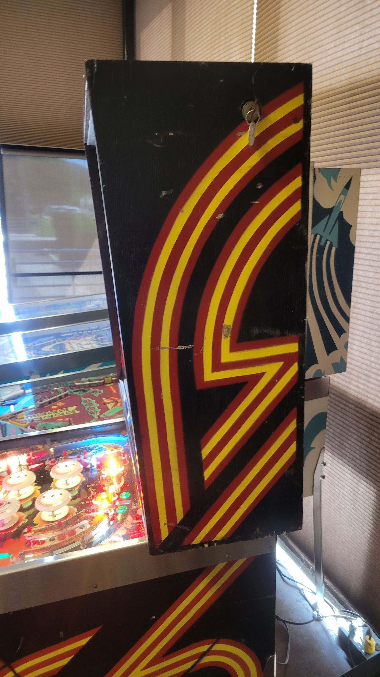 A black box with yellow and red stripes on it