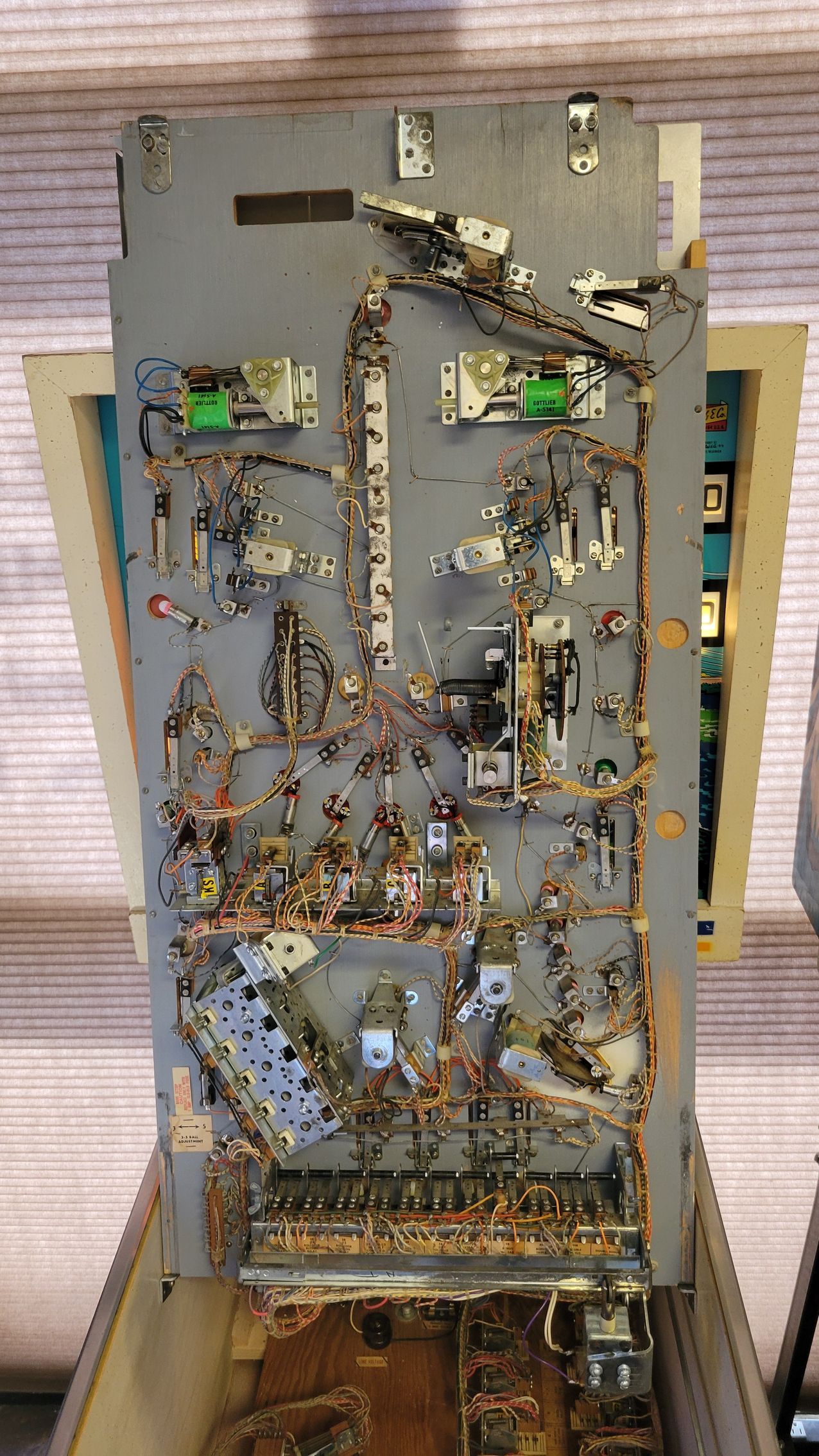 A close up of the inside of a pinball machine.