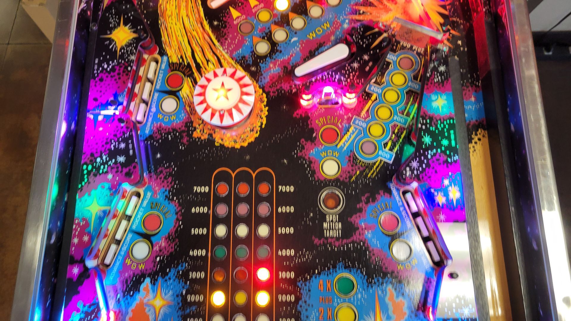 A pinball machine with a colorful design on it