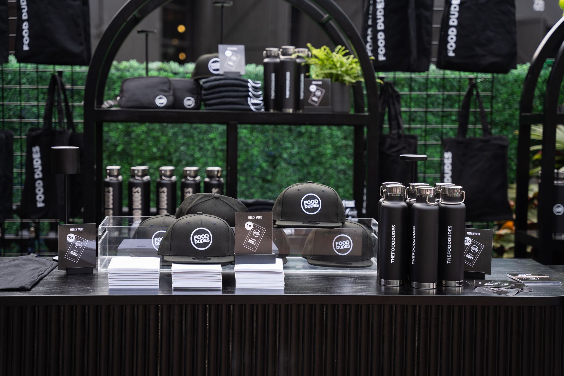 A table with a lot of black items on it