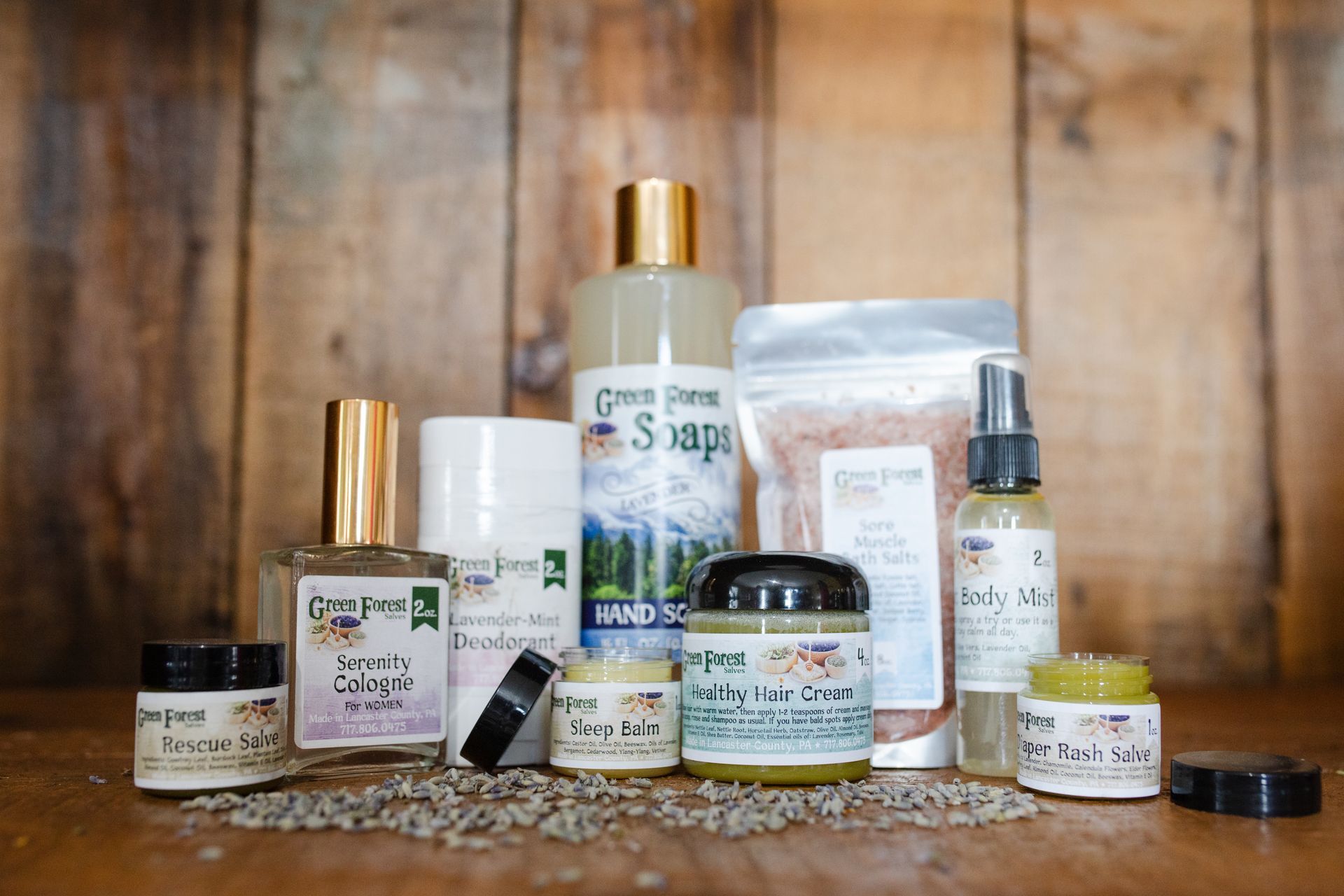 Natural handmade skincare by Green Forest Soaps – eco-friendly display with salves, bath salts, cologne, and more