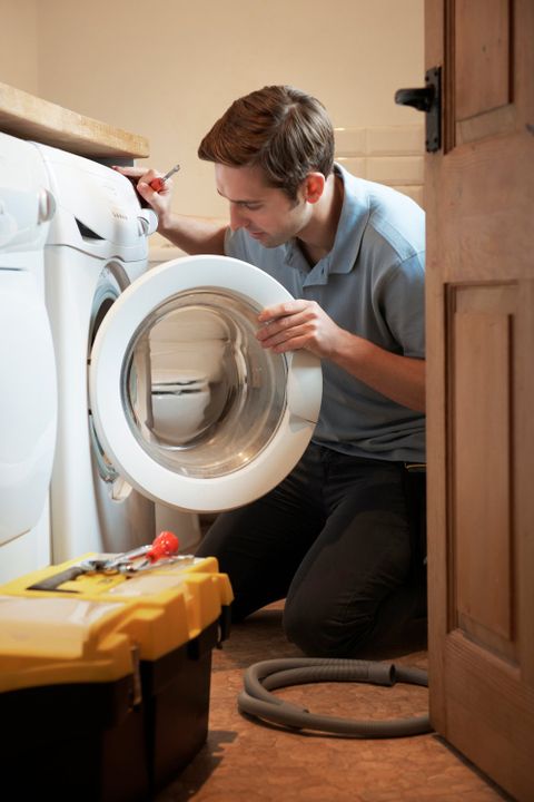 Repairman Fixing Washing Machine — Dyer, IN — Anderson Appliance Repair
