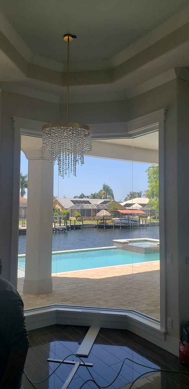 view of pool from inside a home with elegant interior