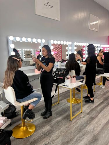 A group of women are getting their hair done in a salon.