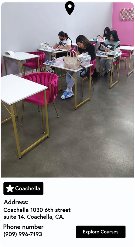 A group of people are sitting at tables in a classroom.