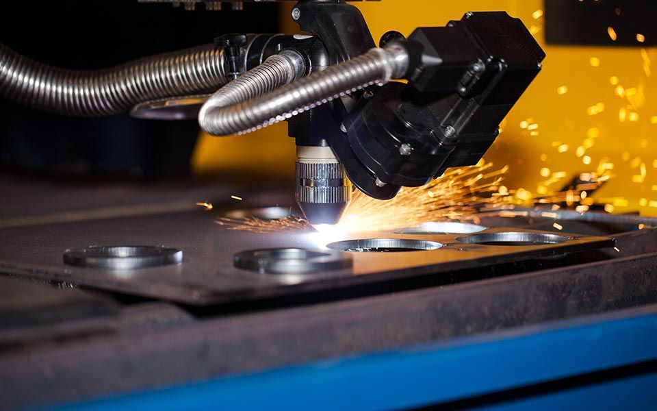 A machine is cutting a piece of metal with sparks coming out of it — Line Boring in Chevallum, QLD