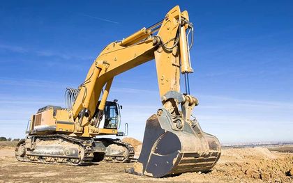 A large yellow excavator is working on a construction site — Line Boring in Chevallum, QLD