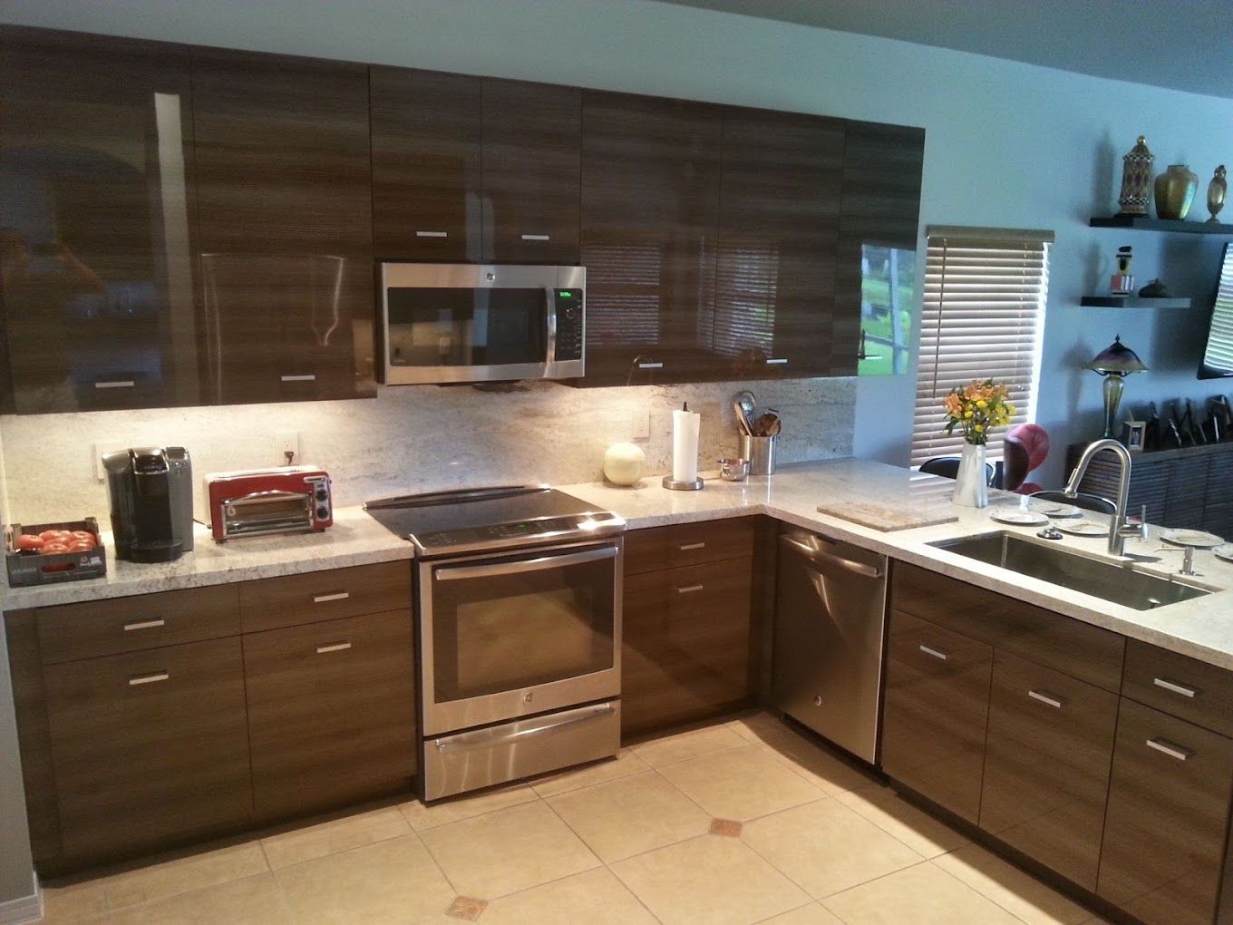 A kitchen with stainless steel appliances and wooden cabinets