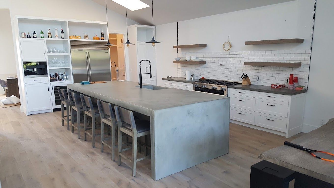 There is a large island in the middle of the kitchen.