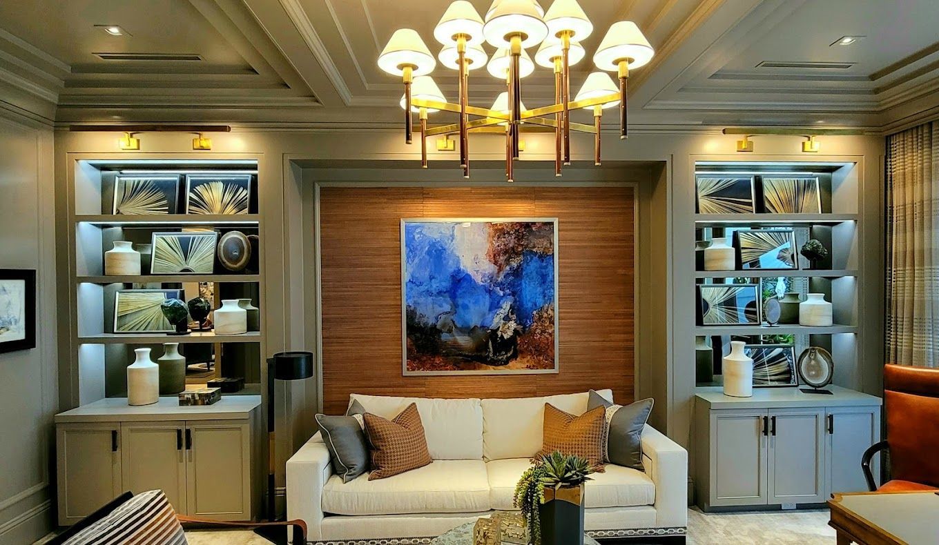 A living room with a couch and a painting on the wall