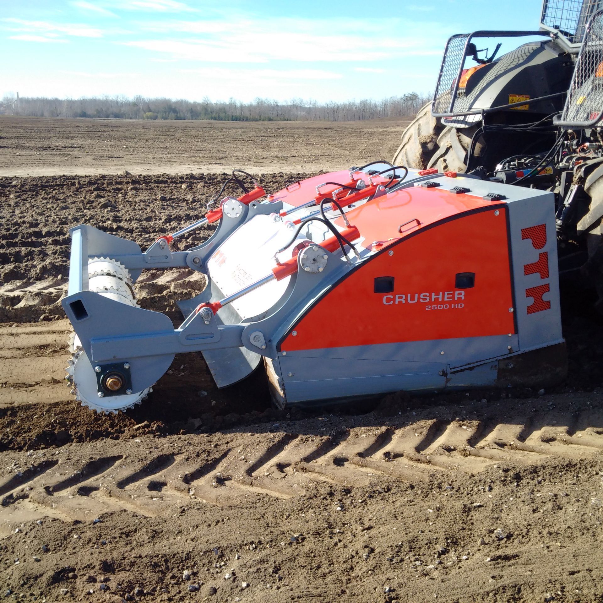 An orange and gray machine with the word crusher on it