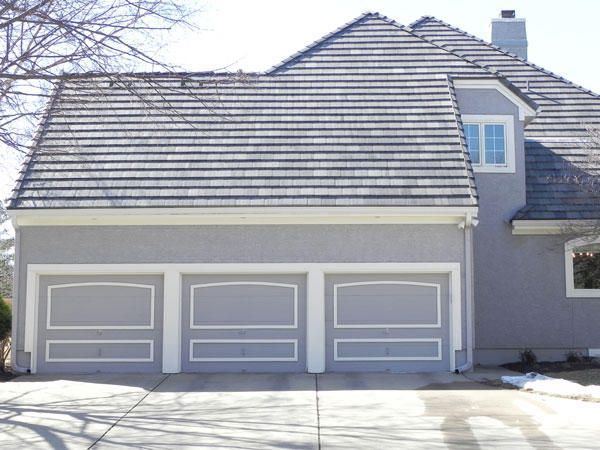 A House with Three Garage Doors and A Gray Roof — Kansas City, KS — All American Roofing
