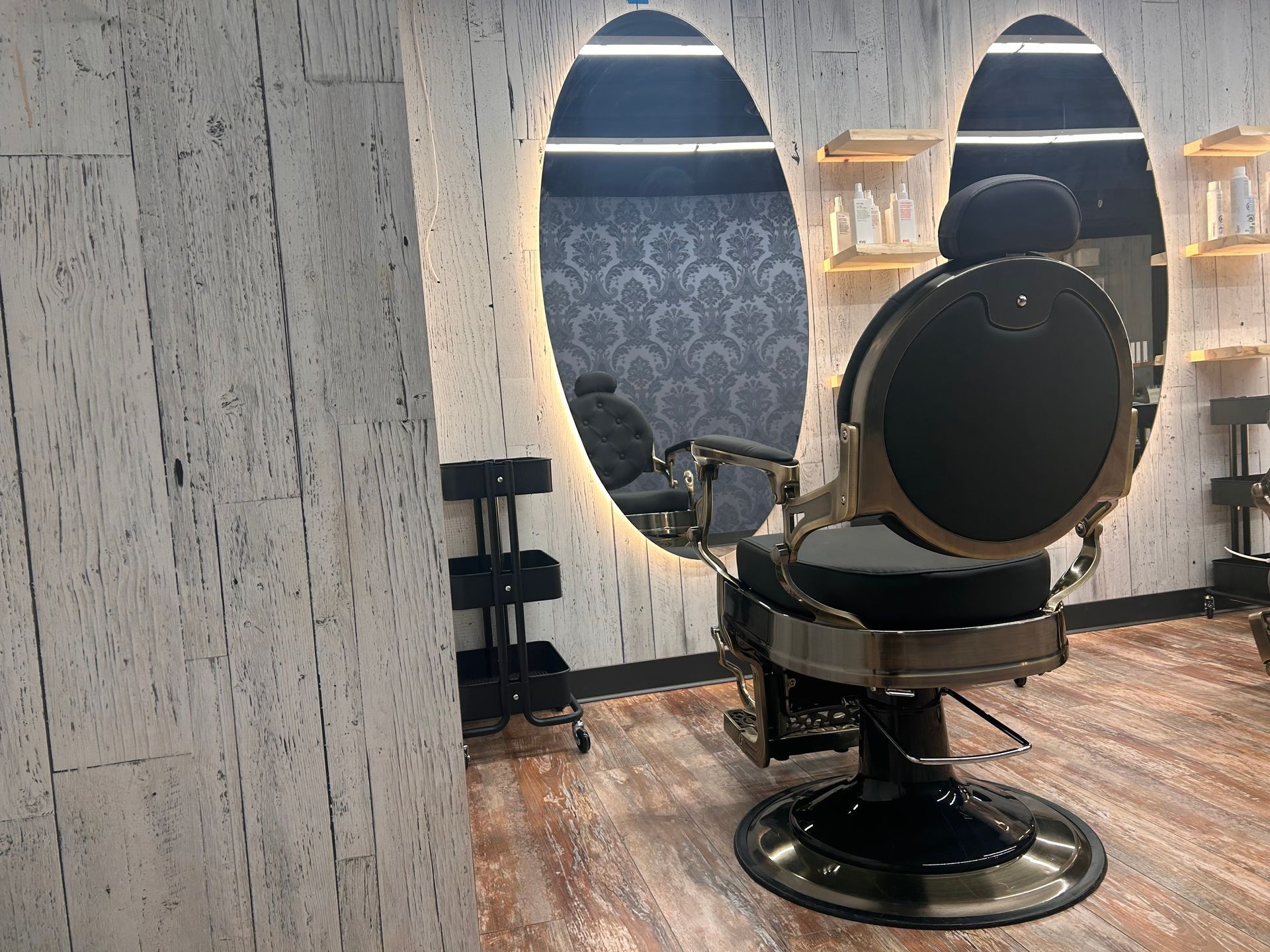 There is a barber chair in the middle of the room.