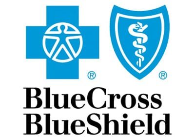 The blue and white logo of Blue Cross Blue Shield featuring a cross and a shield icon with the company name text below.