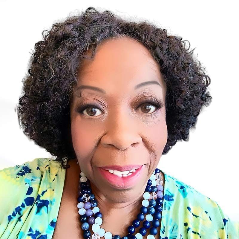 A close-up of two people shaking hands against a bright, minimalist background.