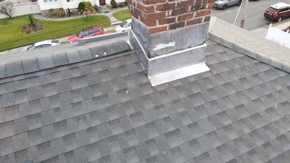 A roof with a chimney on top of it.