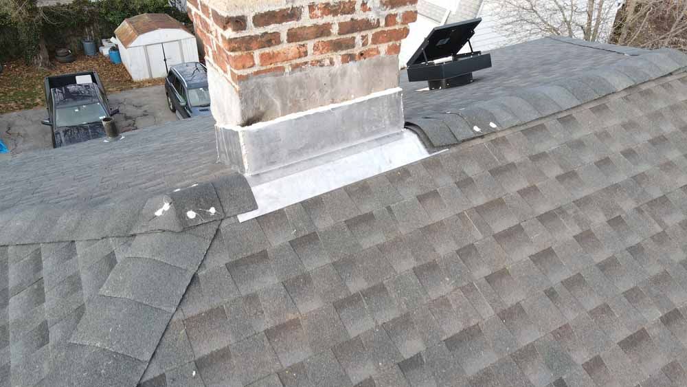 A roof with a chimney on top of it.