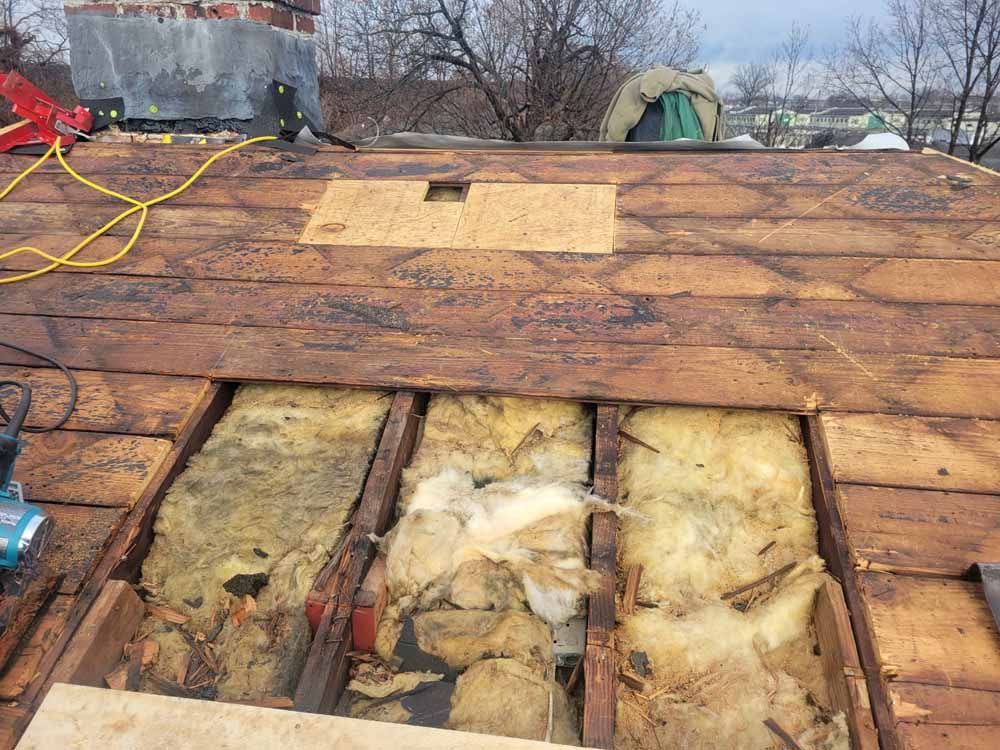 A wooden roof with a hole in the middle of it.