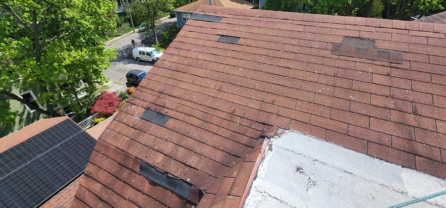 An aerial view of a roof with a lot of shingles on it.