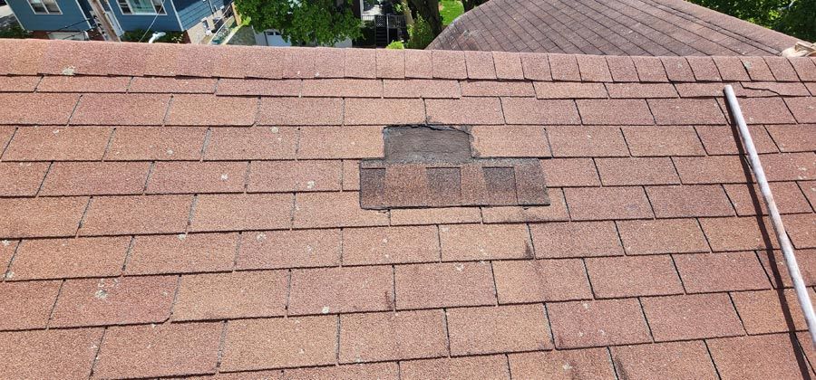 A close up of a roof with a hole in it.