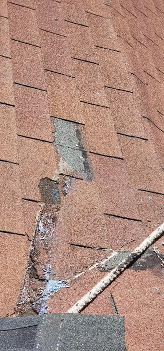 A close up of a roof with a hole in it.