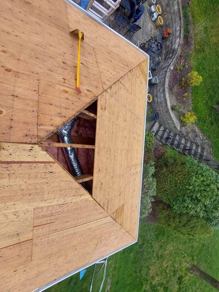 An aerial view of a wooden roof under construction.