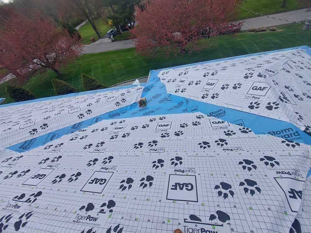 An aerial view of a roof with a lot of shingles on it.