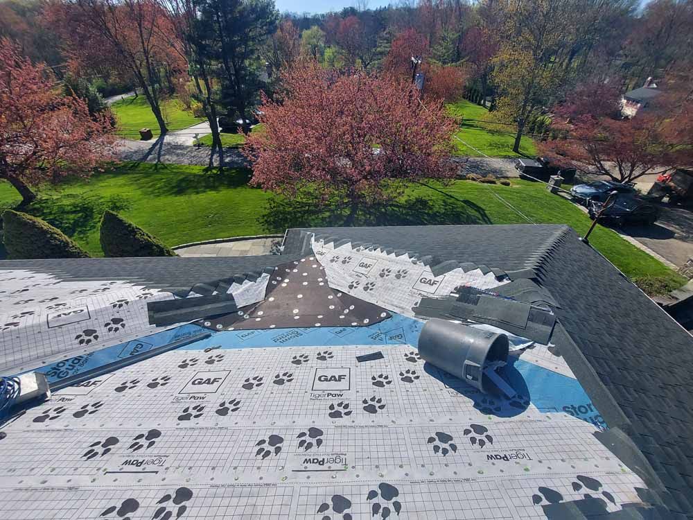 An aerial view of a roof with a pipe on it.