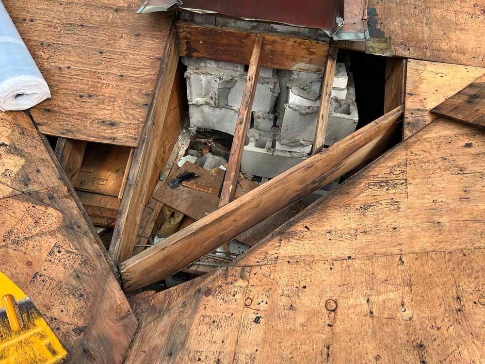 A wooden box with a hole in the middle of it.