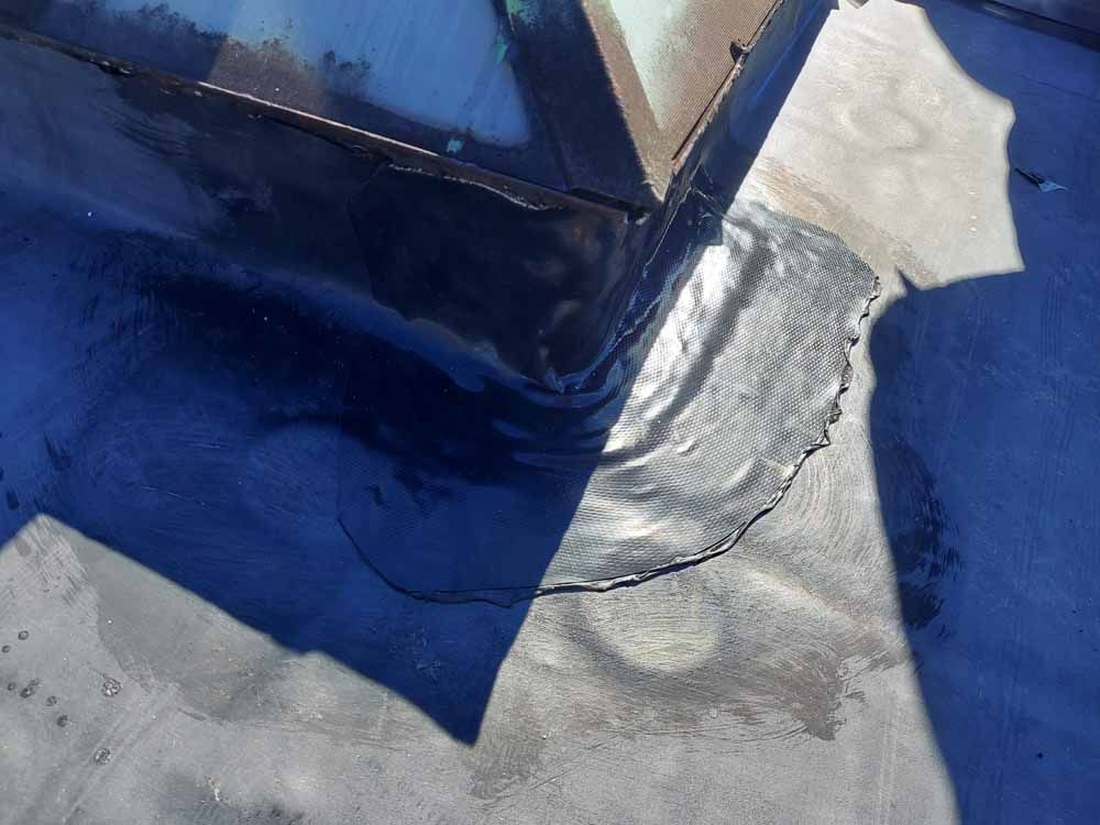 A close up of a blue and silver colored surface