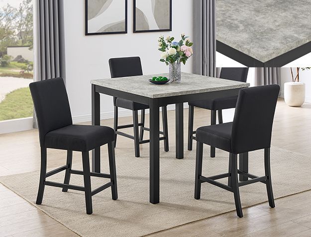 Modern dining table with three black chairs in a bright room
