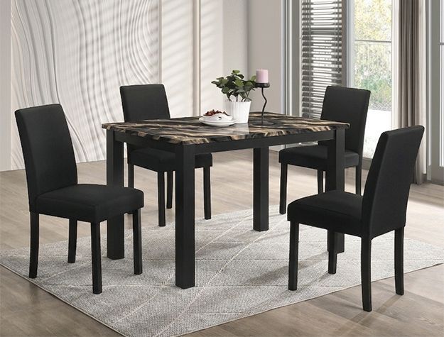 Black dining table with four chairs on a light gray rug in a bright room