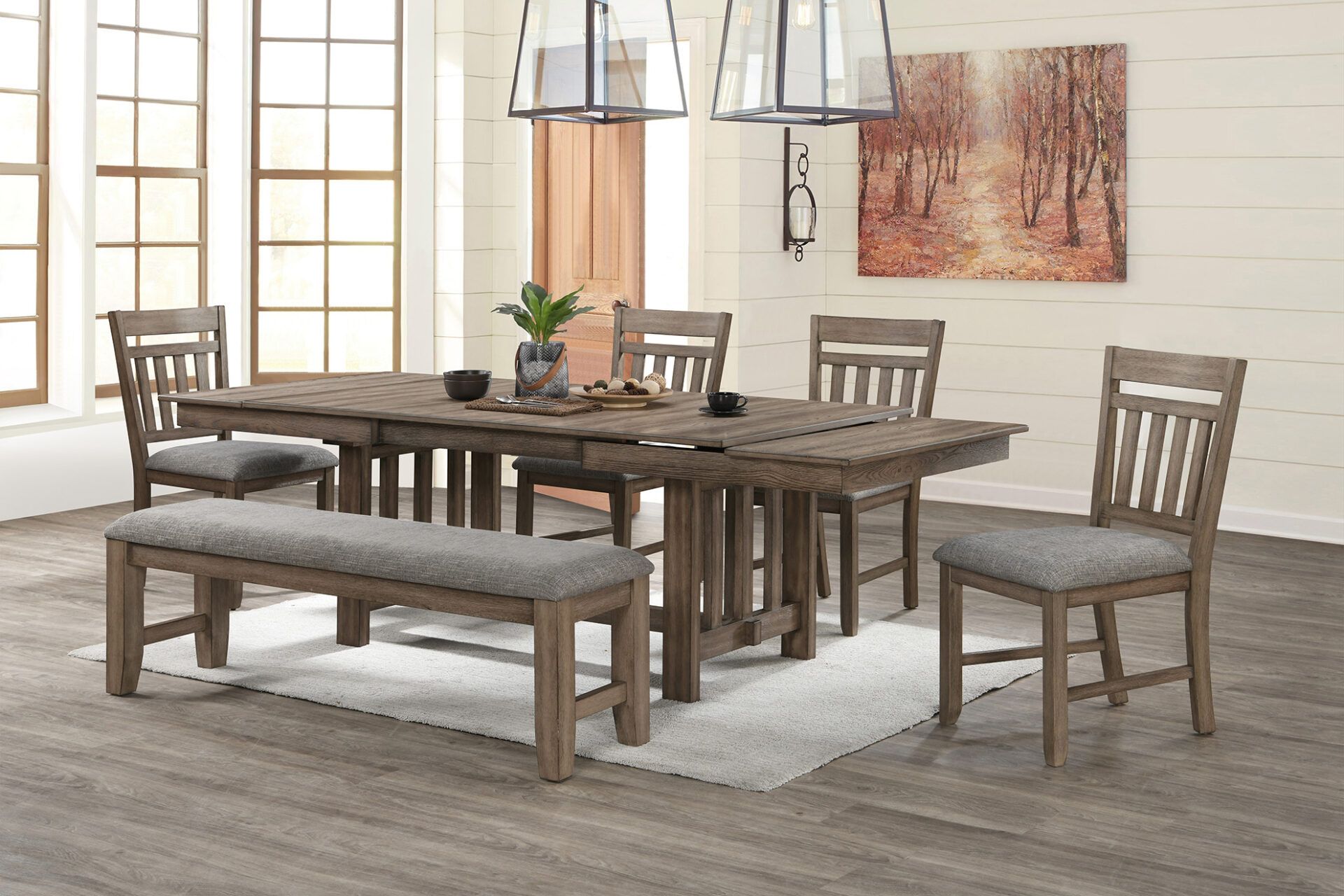 Rustic dining table set with bench and chairs in a bright modern room