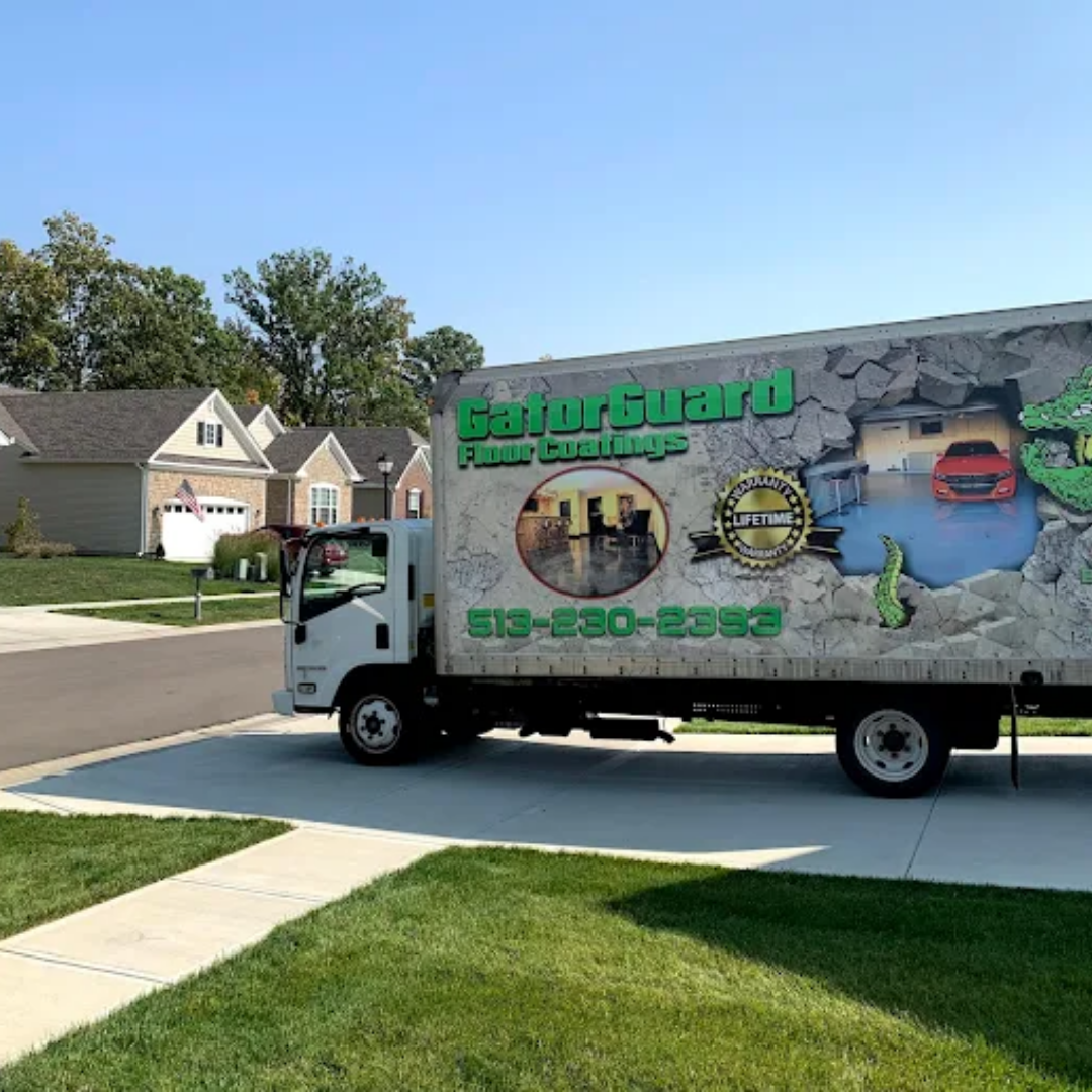 GatorGuard Pool Coatings truck parked on a residential street with a clear sky.