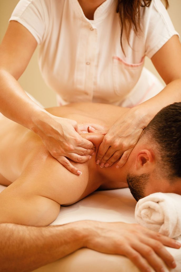 a man is receiving a massage treatment