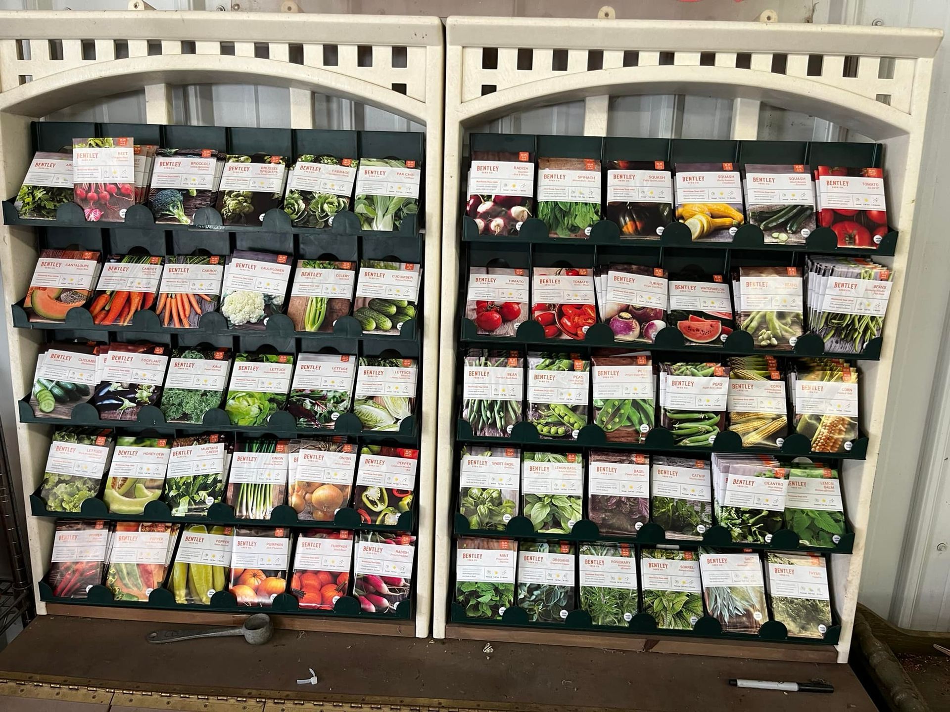 a shelf filled with lots of different types of seeds .