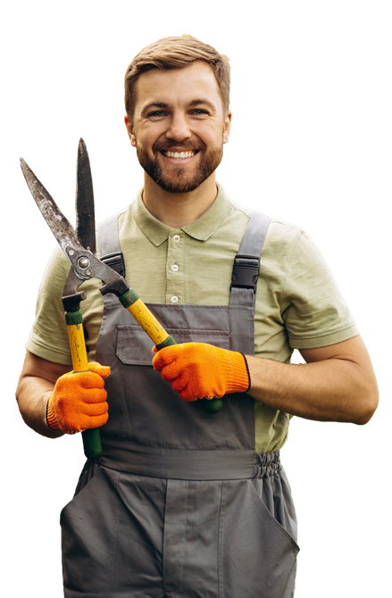 a man in overalls is holding a pair of scissors .