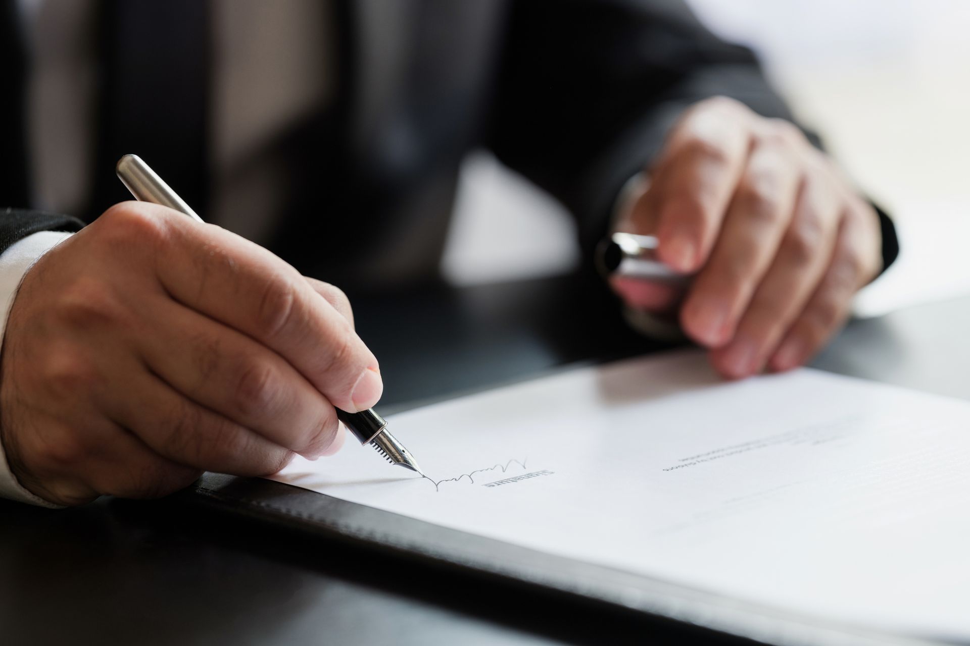 Man Writing on A Piece of Paper — Bristol, TN — Nicewander & Associates