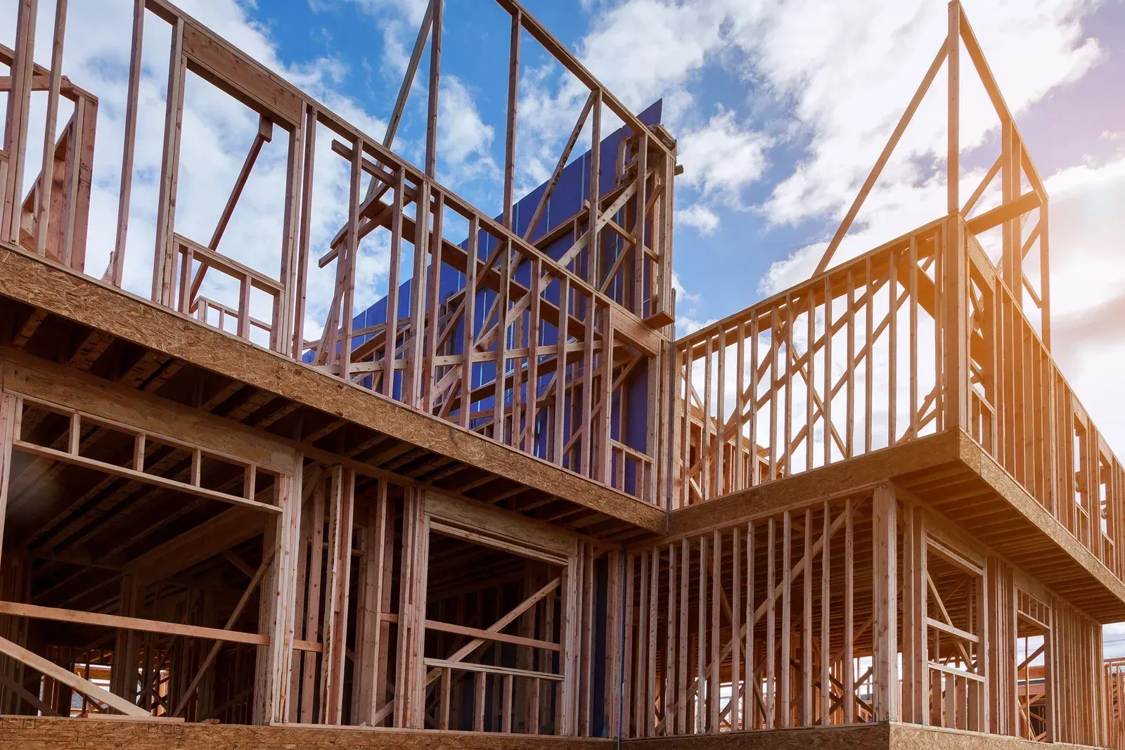 A house is being built with a wooden frame.