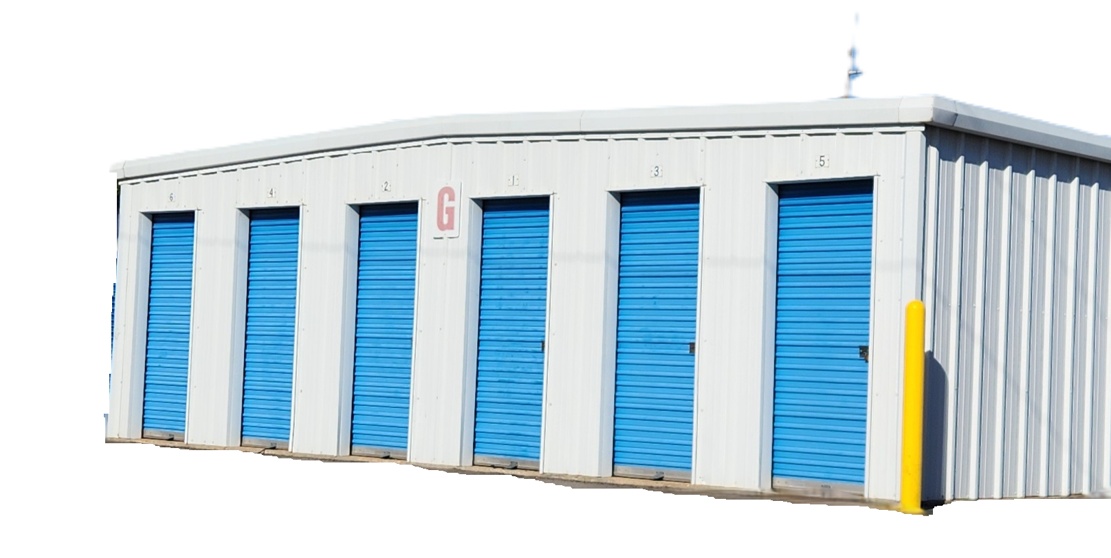 Metal warehouse with open bay, stacked cardboard boxes inside, and a blue trim.