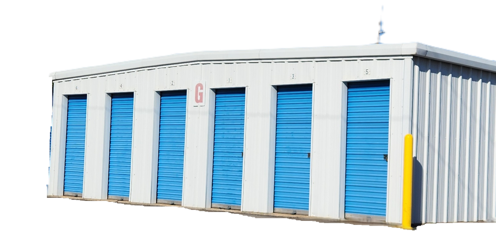 Metal warehouse with open bay, stacked cardboard boxes inside, and a blue trim.