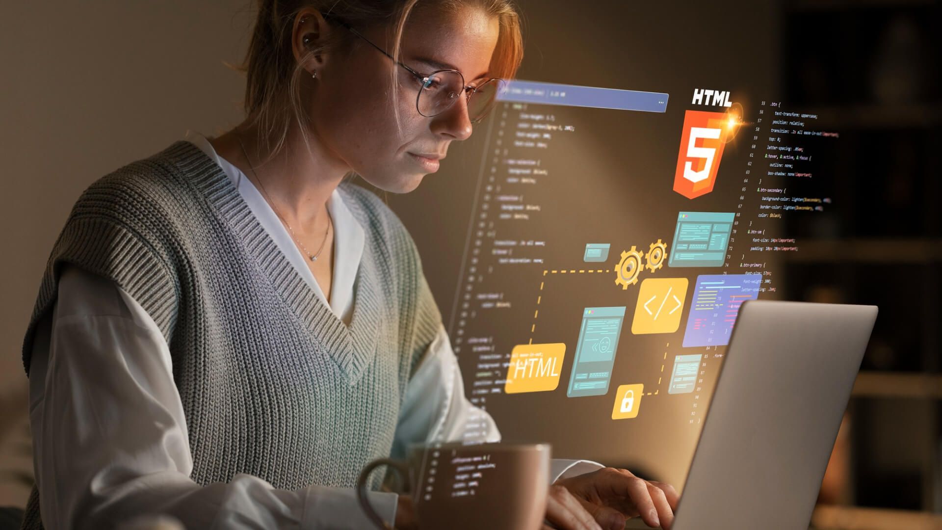 A woman is sitting in front of a laptop computer.