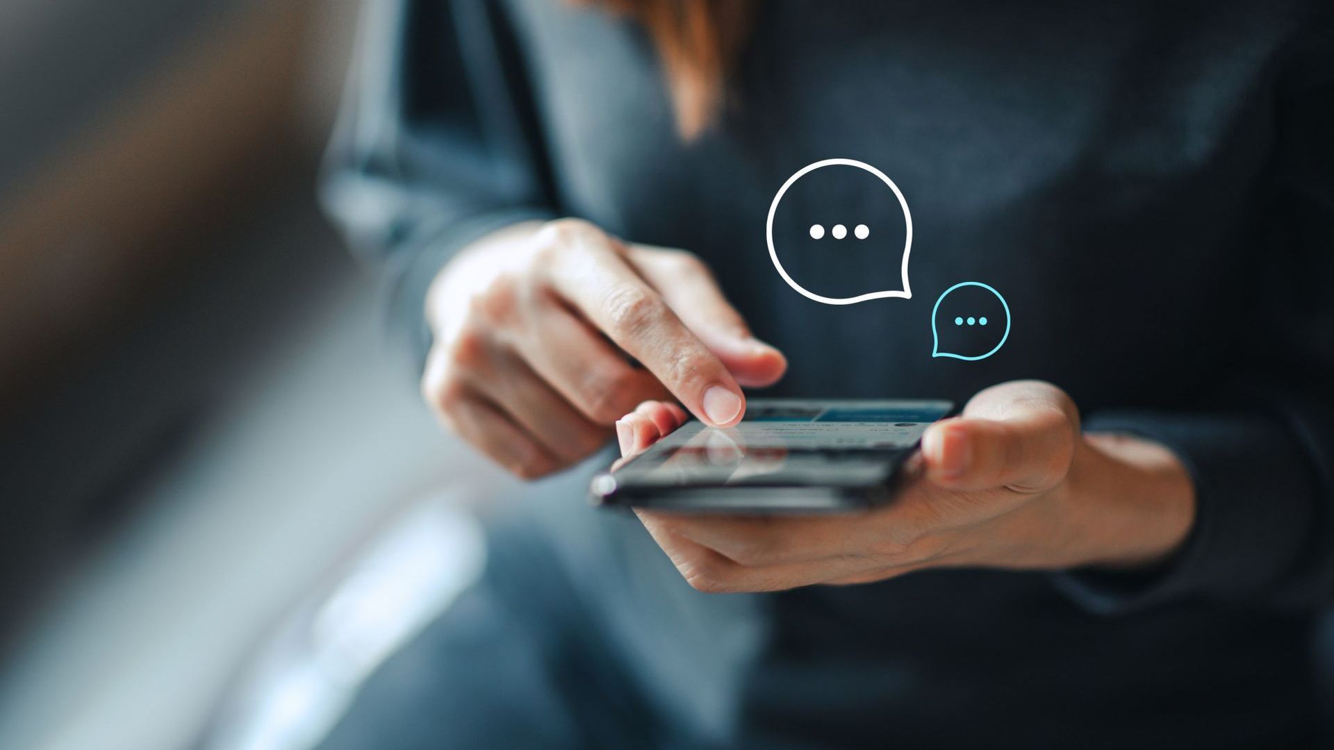 A woman is using a smart phone with speech bubbles coming out of it.