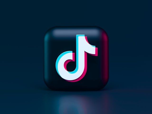 A tiktok icon on a dark blue background.