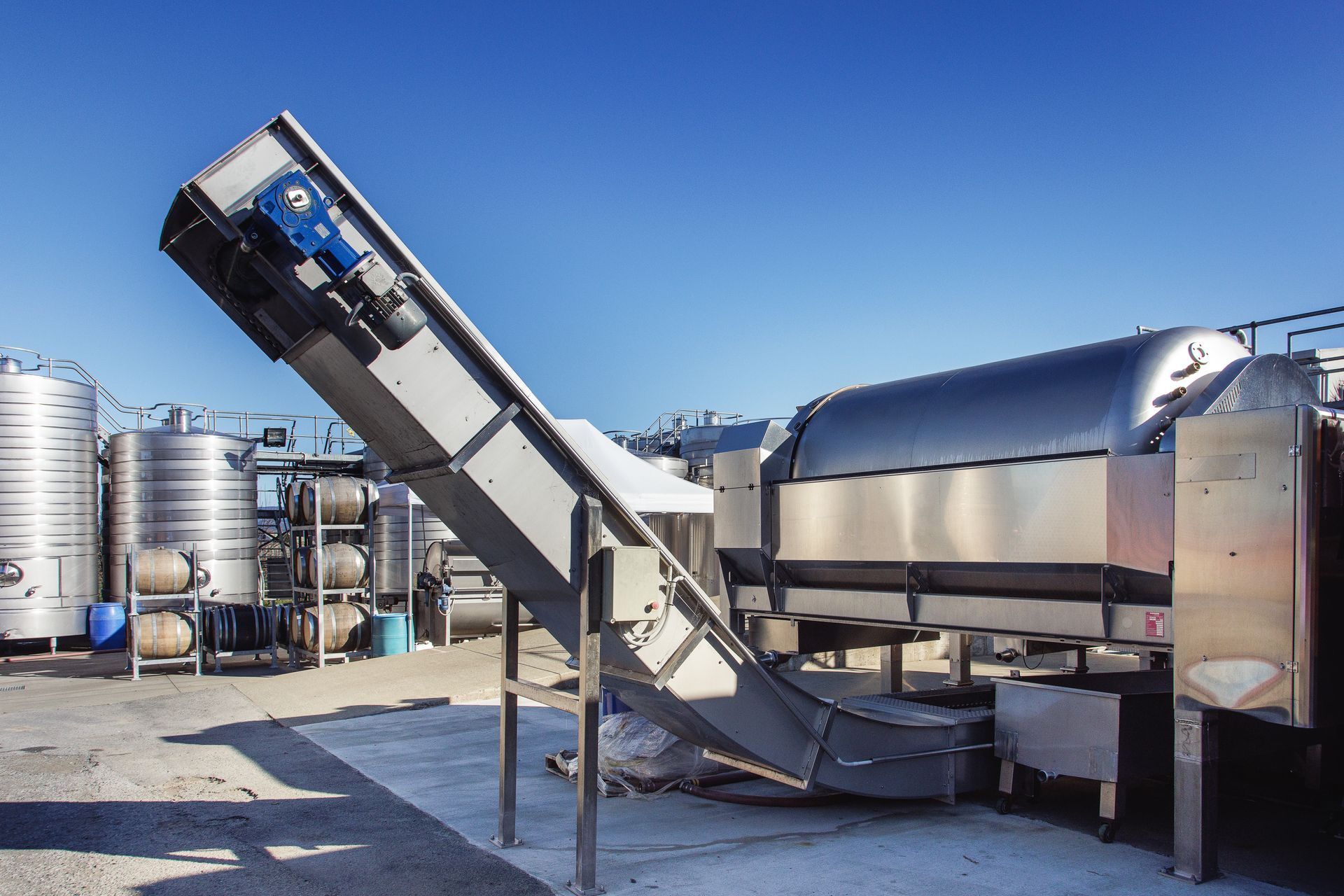 Press and conveyor at Marlborough winery extension, fabricated by GME Tradetech Engineering in Blenheim