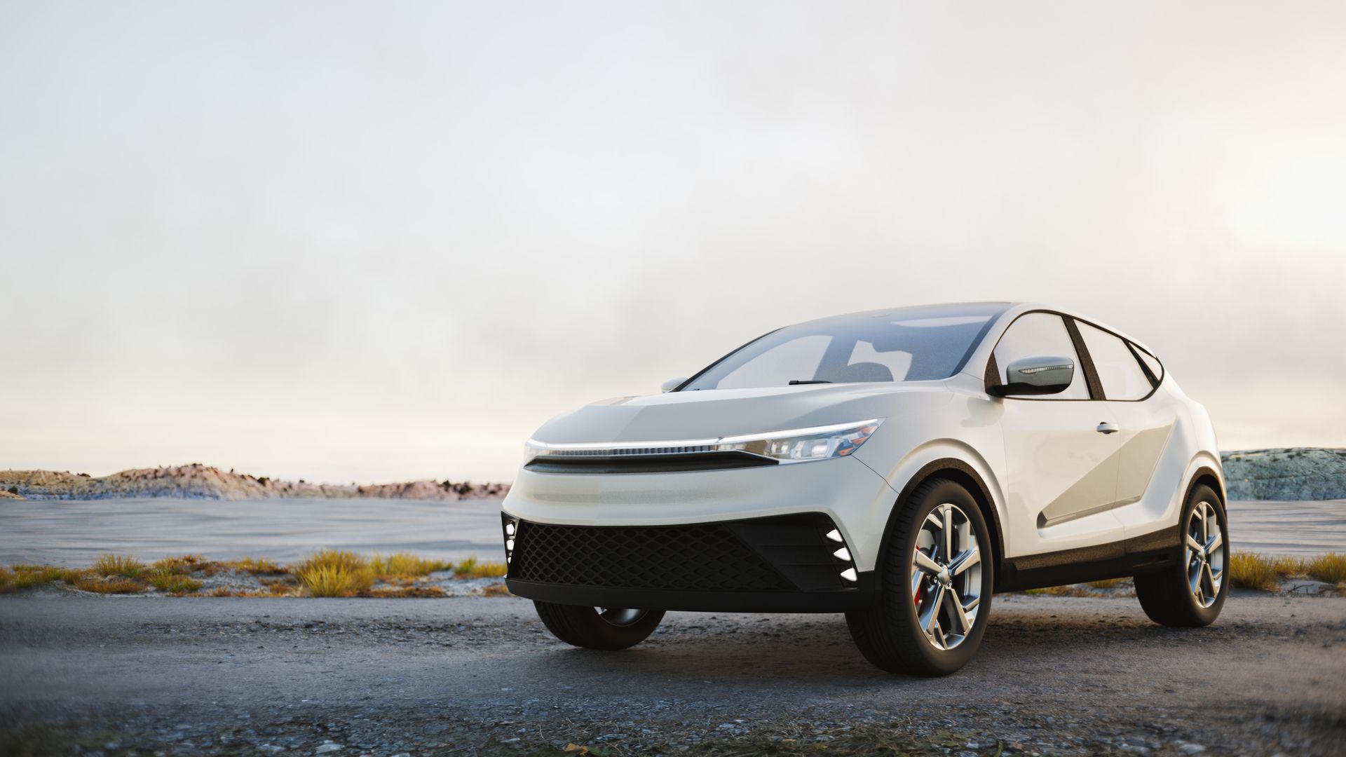White electric SUV parked on a paved road with a backdrop of a field and overcast sky.