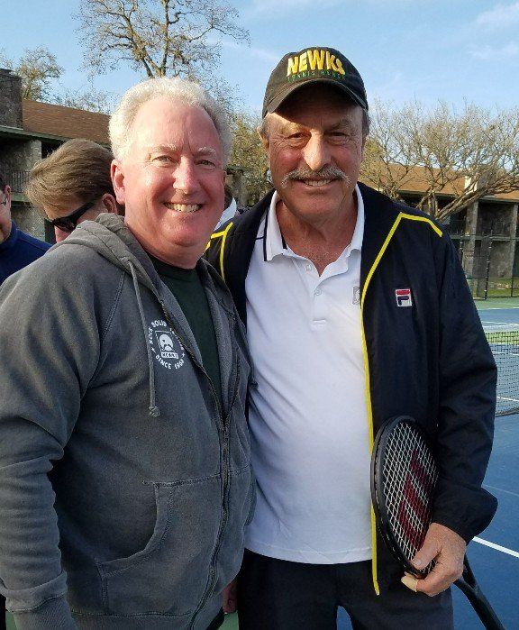 Barry Dahl with tennis legend John Newcombe