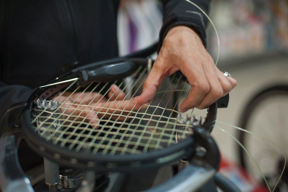 Racket stringer at work